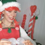 Holiday elf practicing their balloon animals